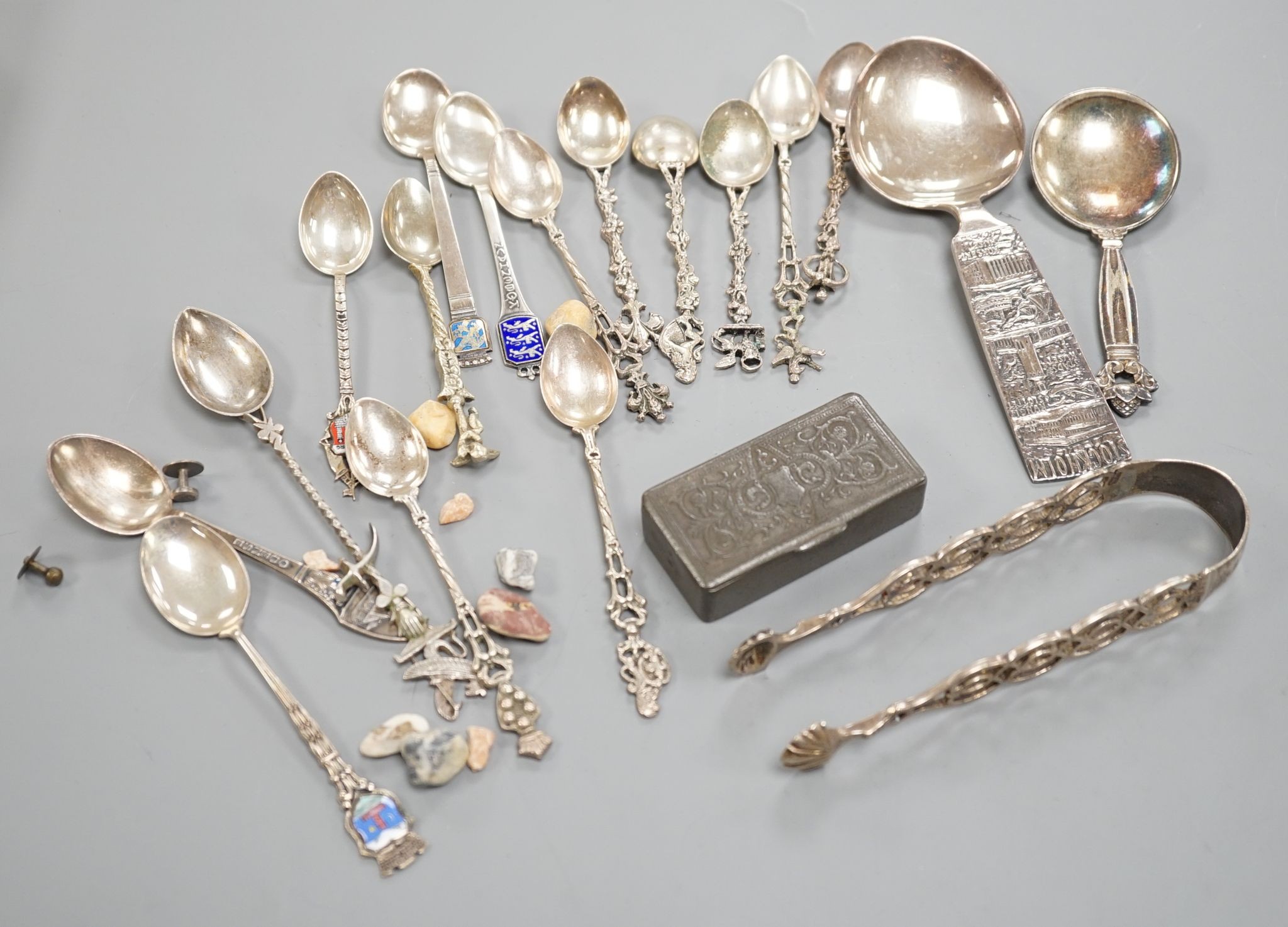 A Georg Jensen & Wendel A/S sterling small spoon, 10.2cm, a pair of antique silver sugar tongs(a.f.), a metal snuff box and a small group of minor spoons including continental white metal.